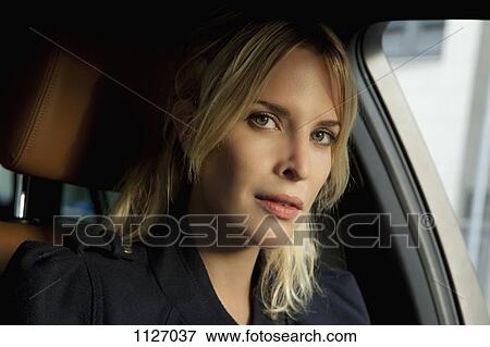 Portrait of woman in car View Large Photo Image Stock Photo - Portrait of woman in car. Fotosearch