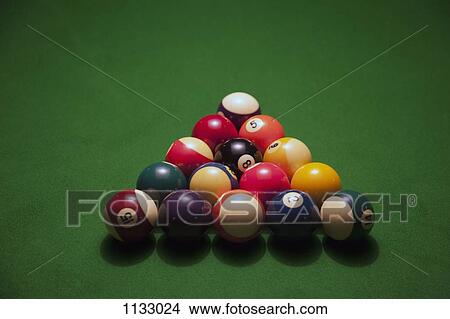 Racked pool balls on a green felt pool table View Large Photo Image Picture - Racked pool balls on a green felt pool table. Fotosearch