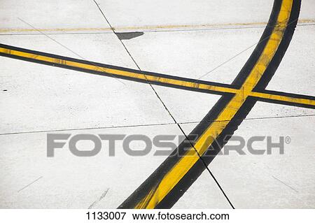 Road markings on an airplane runway View Large Photo Image Stock Photo - Road markings on an airplane runway. Fotosearch