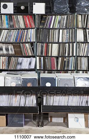 Rows of records on shelves and in bins at a record store View Large Photo Image Stock Photo - Rows of records on shelves and in bins at a record store. Fotosearch