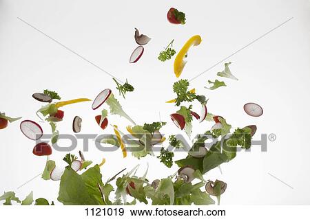 Salad against a white background View Large Photo Image Stock Photo - Salad against a white background. Fotosearch