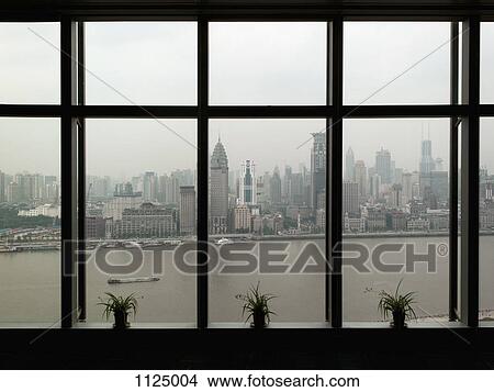 Shanghai skyline seen through window View Large Photo Image Picture - Shanghai skyline seen through window. Fotosearch