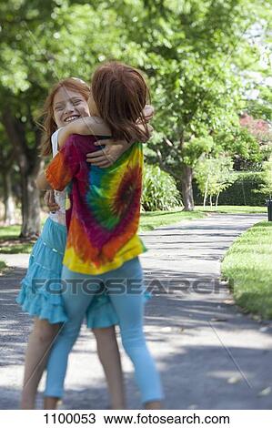 Siblings hugging in Park View Large Photo Image Stock Image - Siblings hugging in Park. Fotosearch