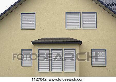 Side of house with window shutters down View Large Photo Image Stock Image - Side of house with window shutters down. Fotosearch