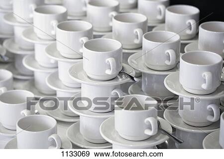Stacks of cups and saucers View Large Photo Image Stock Photo - Stacks of cups and saucers. Fotosearch