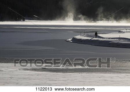 Stock Image - Steam rising from Lake Silvaplana in Switzerland. Fotosearch