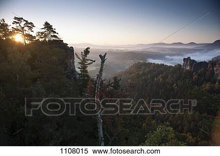 Stock Photography - Sun rising on the Bastei, Elbe Sandstone Mountains, Saxon Switzerland National Park. Fotosearch