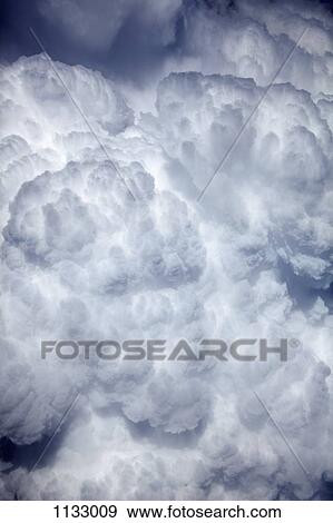 Sunlight on a cloudscape, full frame View Large Photo Image Stock Photo - Sunlight on a cloudscape, full frame. Fotosearch