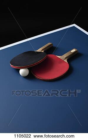 Table tennis bats and a ball on a table View Large Photo Image Stock Image - Table tennis bats and a ball on a table. Fotosearch