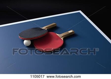 Table tennis bats and a ball on a table View Large Photo Image Stock Photo - Table tennis bats and a ball on a table. Fotosearch