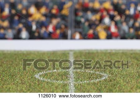 The center field of a miniature soccer field, spectator figurines in background View Large Photo Image Stock Image - The center field of a miniature soccer field, spectator figurines in background. Fotosearch
