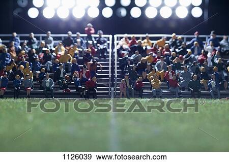 The center field of a miniature soccer field, spectator figurines in background View Large Photo Image Stock Photo - The center field of a miniature soccer field, spectator figurines in background. Fotosearch