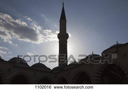 The minaret of a mosque back lit by the sun View Large Photo Image Stock Photograph - The minaret of a mosque back lit by the sun. Fotosearch