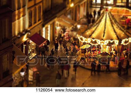 Tilt-shift of a crowd of people at a carousel at an outdoor festival, Strasbourg, France View Large Photo Image Picture - Tilt-shift of a crowd of people at a carousel at an outdoor festival, Strasbourg, France. Fotosearch