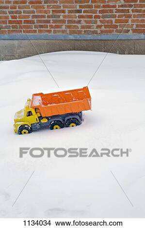Toy Dumper truck in the snow View Large Photo Image Picture - Toy Dumper truck in the snow. Fotosearch