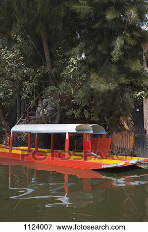 Two Trajinera boats, a gondola type Mexican tour boat View Large Photo Image Stock Photo - Two Trajinera boats, a gondola type Mexican tour boat. Fotosearch