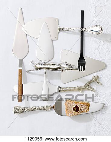 Various cake servers and a slice of cake View Large Photo Image Stock Photograph - Various cake servers and a slice of cake. Fotosearch