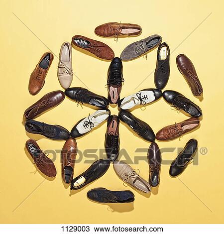 Stock Image - Various lace up shoes arranged in a pattern. Fotosearch