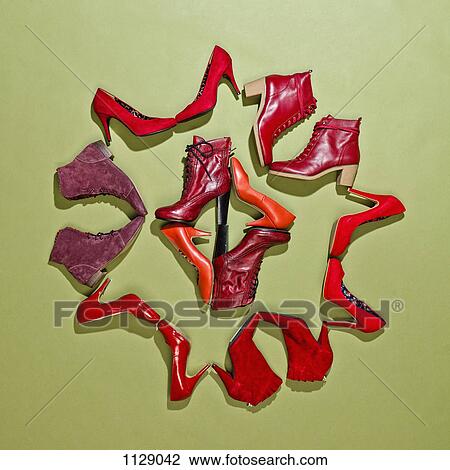 Various pairs of red shoes arranged in a pattern View Large Photo Image Stock Image - Various pairs of red shoes arranged in a pattern. Fotosearch