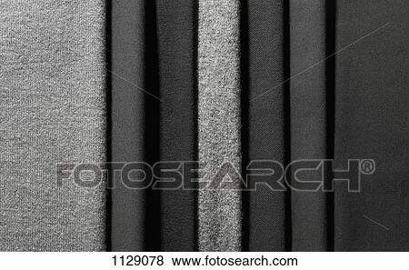 Varying shades of gray textiles hanging in a row View Large Photo Image Stock Photo - Varying shades of gray textiles hanging in a row. Fotosearch