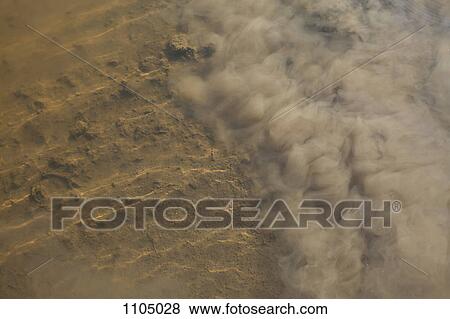 Wind blowing dust View Large Photo Image Stock Photo - Wind blowing dust. Fotosearch