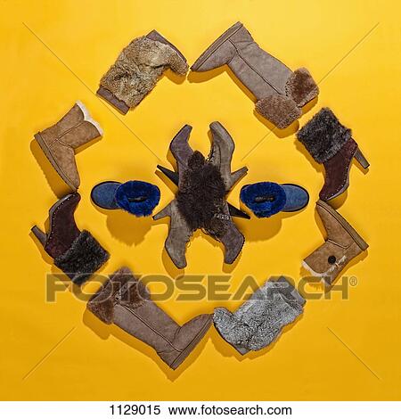 Stock Photography - Winter boots arranged in a pattern. Fotosearch
