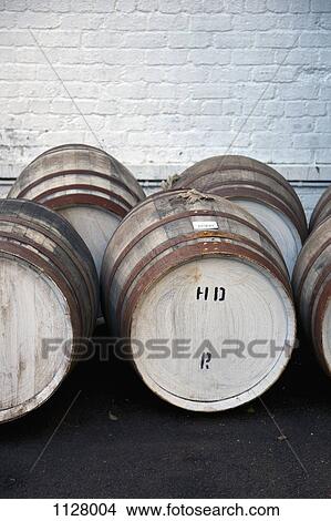 Wooden barrels at a whiskey distillery View Large Photo Image Picture - Wooden barrels at a whiskey distillery. Fotosearch