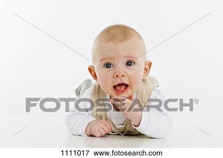 A baby boy lying on his front View Large Photo Image Stock Photo - A baby boy lying on his front. Fotosearch