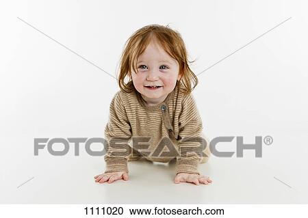 A baby girl crawling View Large Photo Image Stock Image - A baby girl crawling. Fotosearch