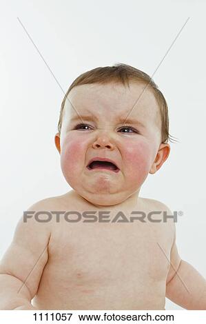 Stock Photo - A baby girl crying. Fotosearch