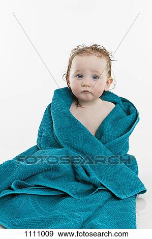 A baby girl wrapped in a towel View Large Photo Image Stock Photo - A baby girl wrapped in a towel. Fotosearch