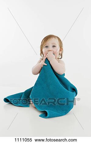 A baby girl wrapped in a towel View Large Photo Image Stock Photography - A baby girl wrapped in a towel. Fotosearch