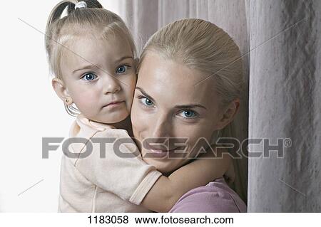 A beautiful young girl and her mother, close-up View Large Photo Image Stock Photo - A beautiful young girl and her mother, close-up. Fotosearch