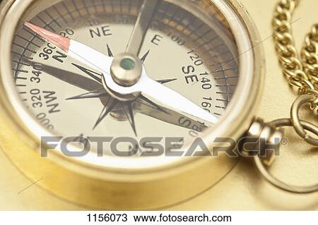 A brass pocket compass, close-up View Large Photo Image Stock Image - A brass pocket compass, close-up. Fotosearch