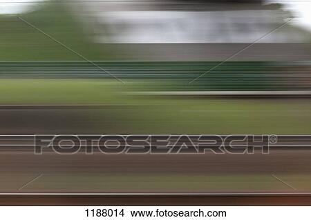A building and abstract pattern in blurred motion viewed from moving train View Large Photo Image Picture - A building and abstract pattern in blurred motion viewed from moving train. Fotosearch