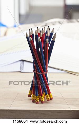 A bundle of sharpened pencils standing upright on an office desk View Large Photo Image Picture - A bundle of sharpened pencils standing upright on an office desk. Fotosearch
