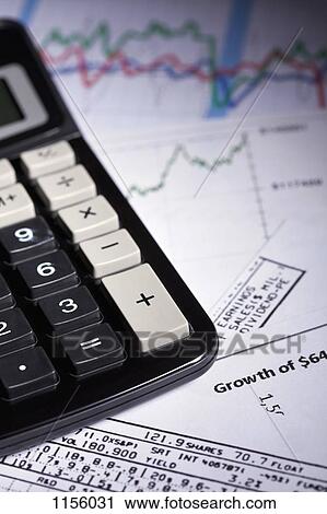A calculator on top of a mess of papers with stock market data View Large Photo Image Stock Image - A calculator on top of a mess of papers with stock market data . Fotosearch