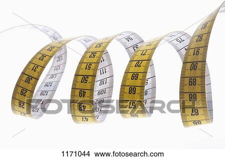Picture - A centimeter tape measure arranged in a spiral shape. Fotosearch