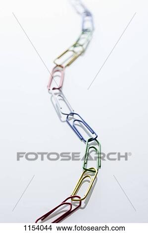 A chain of paperclips, diminishing perspective View Large Photo Image Picture - A chain of paperclips, diminishing perspective. Fotosearch