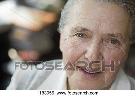 Stock Photograph - A cheerful senior woman, close-up. Fotosearch