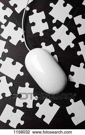 A computer mouse on top of jigsaw puzzle pieces View Large Photo Image Stock Image - A computer mouse on top of jigsaw puzzle pieces. Fotosearch