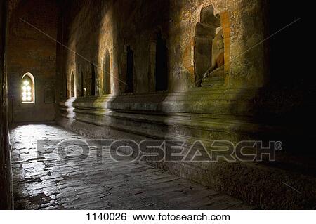 Stock Photograph - A corridor in a Buddhist temple, Bagan, Burma. Fotosearch