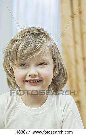 Stock Photo - A cute, grinning little girl. Fotosearch