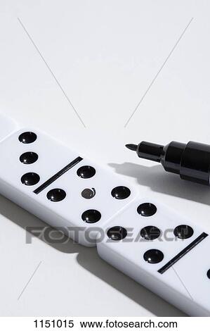 A domino with a fake dot on it, felt tip marker nearby View Large Photo Image Stock Photography - A domino with a fake dot on it, felt tip marker nearby. Fotosearch