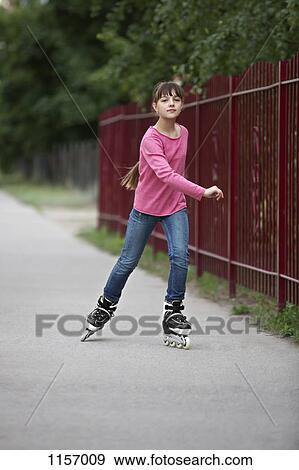 A girl inline skating View Large Photo Image Stock Photo - A girl inline skating. Fotosearch