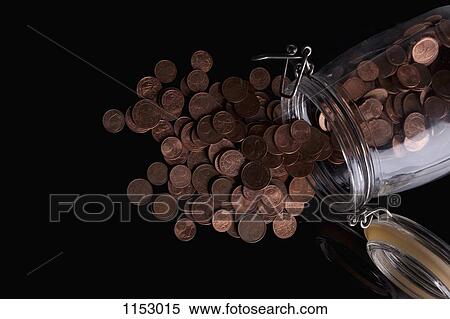 A glass jar spilling copper Euro coins View Large Photo Image Stock Photography - A glass jar spilling copper Euro coins. Fotosearch