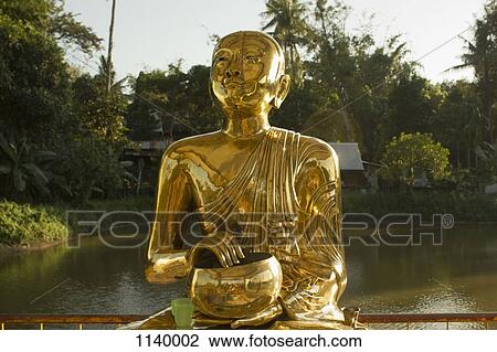 A gold Buddhist statue, Yangon, Burma View Large Photo Image Stock Image - A gold Buddhist statue, Yangon, Burma. Fotosearch