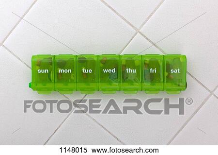 A green pill organizer with the abbreviated days of the week View Large Photo Image Stock Photography - A green pill organizer with the abbreviated days of the week. Fotosearch