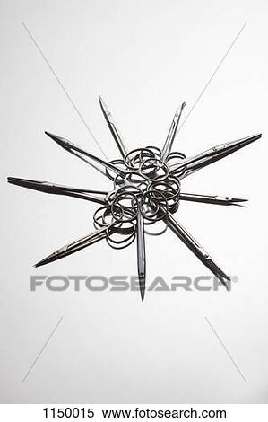 Stock Photography - A group of surgical scissors arranged in a circular pattern. Fotosearch