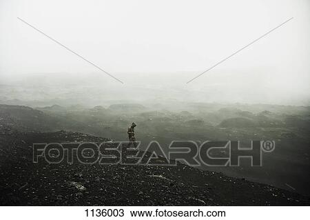A hiker walking through the fog, Plosky Tolbachik Volcano, Russia View Large Photo Image Stock Image - A hiker walking through the fog, Plosky Tolbachik Volcano, Russia. Fotosearch